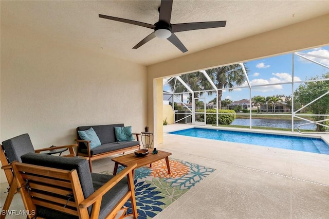 7912 Umberto Ct, Naples, FL 34114 - view of swimming pool with outdoor lounge area, ceiling fan, glass enclosure, a water view, and a patio area