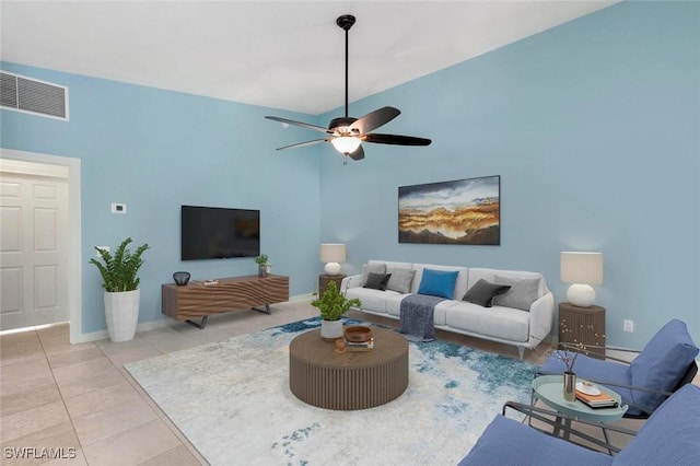 7912 Umberto Ct, Naples, FL 34114 - tiled living room featuring ceiling fan and a towering ceiling