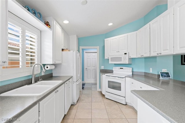7912 Umberto Ct, Naples, FL 34114 - kitchen featuring light tile patterned flooring, white appliances, sink, and white cabinets
