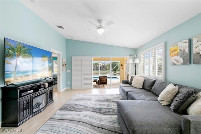 7912 Umberto Ct, Naples, FL 34114 - living room with ceiling fan, lofted ceiling, and light hardwood / wood-style floors