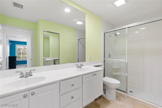 7912 Umberto Ct, Naples, FL 34114 - bathroom featuring vanity, an enclosed shower, tile patterned floors, and toilet