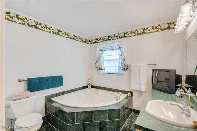 bathroom with vanity, a relaxing tiled tub, and toilet