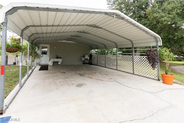 view of vehicle parking featuring a carport