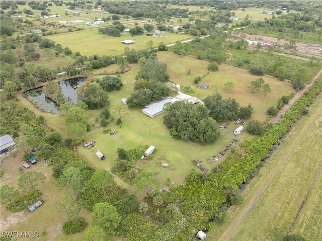 aerial view featuring a rural view and a water view