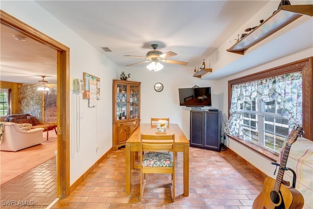 dining room featuring ceiling fan