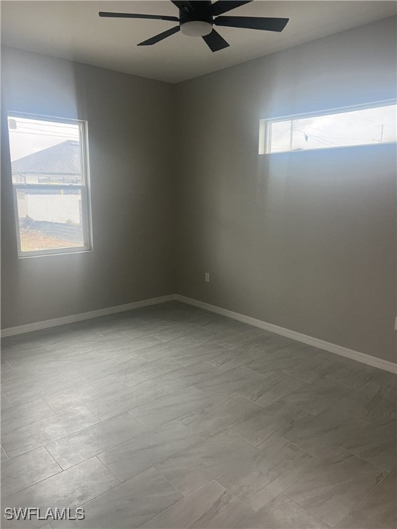 spare room featuring ceiling fan