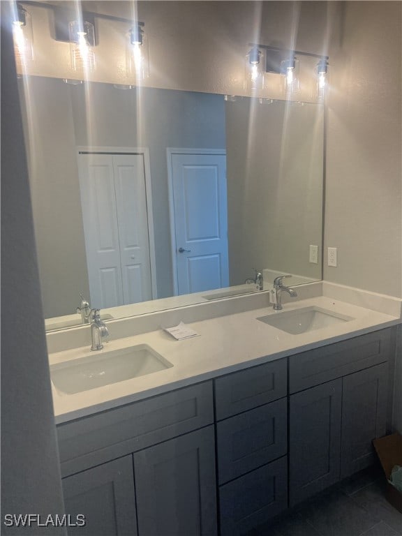 bathroom with vanity and tile patterned flooring