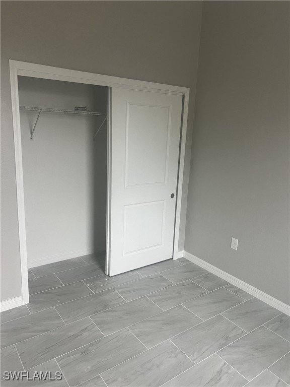 unfurnished bedroom featuring a closet