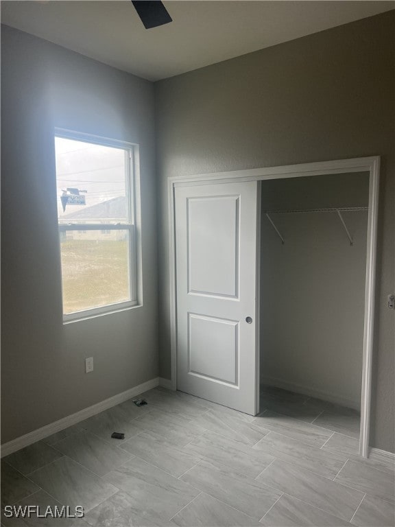 unfurnished bedroom with a closet