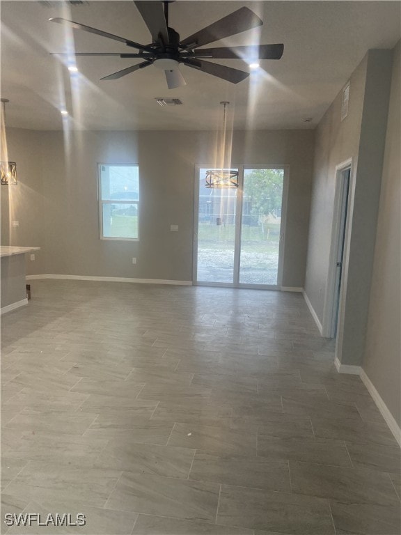 unfurnished room with ceiling fan