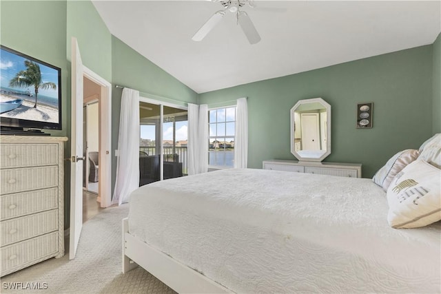 carpeted bedroom featuring lofted ceiling and ceiling fan