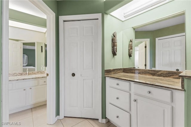 bathroom with vanity and tile patterned floors