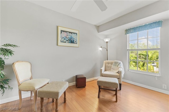 sitting room featuring ceiling fan and light hardwood / wood-style floors