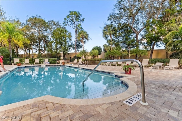 view of swimming pool with a patio area