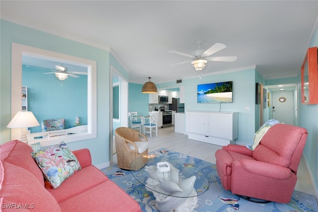 living room featuring ceiling fan, ornamental molding, and light hardwood / wood-style flooring