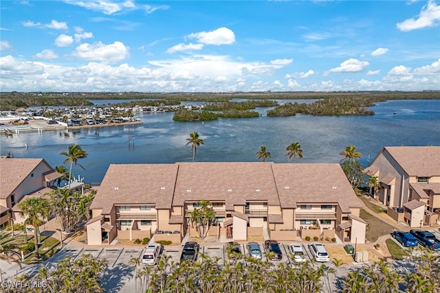 birds eye view of property featuring a water view