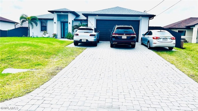 view of front of house featuring a garage and a front yard