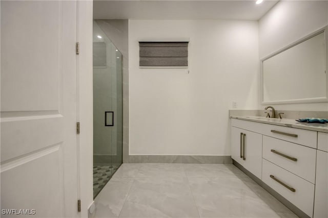 bathroom featuring an enclosed shower and vanity