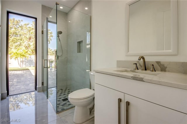 bathroom with vanity, toilet, an enclosed shower, and tile patterned flooring