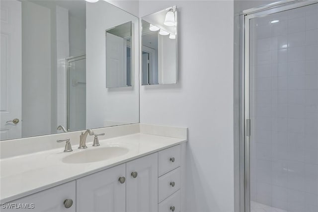 bathroom with vanity and an enclosed shower