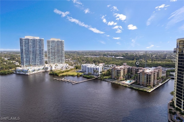 drone / aerial view featuring a water view and a city view