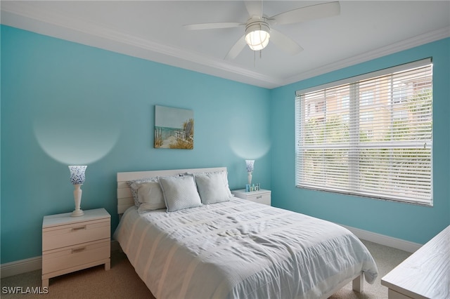 bedroom featuring crown molding, a ceiling fan, baseboards, and light colored carpet