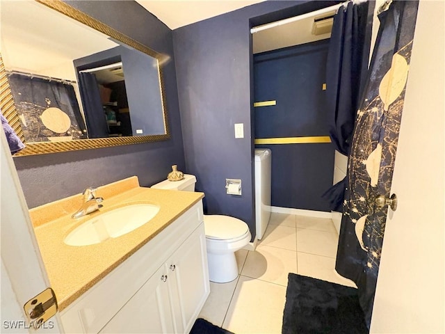 bathroom featuring vanity, toilet, and tile patterned flooring