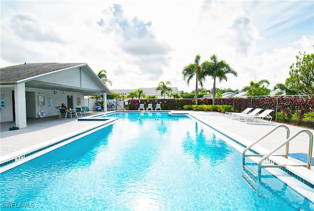 view of swimming pool with a patio