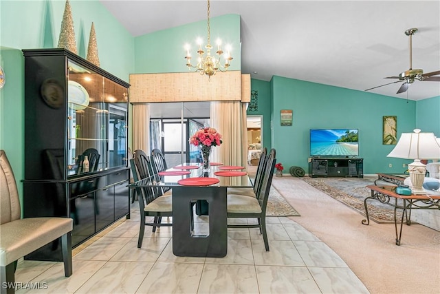 dining area with ceiling fan with notable chandelier, lofted ceiling, and light colored carpet