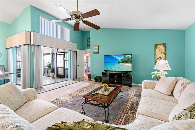 living room with high vaulted ceiling and ceiling fan