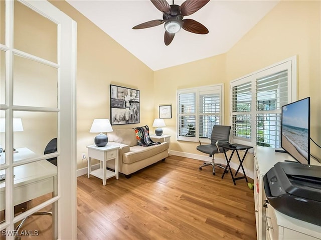 office space with wood-type flooring, lofted ceiling, and ceiling fan