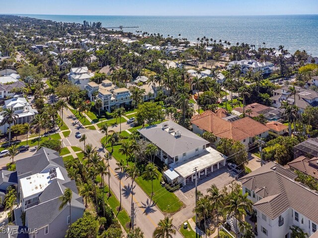 birds eye view of property with a water view and a residential view