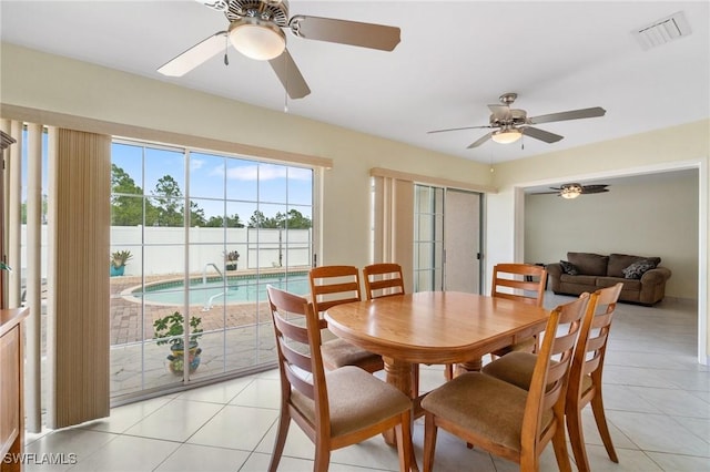 dining room with light tile patterned floors and visible vents