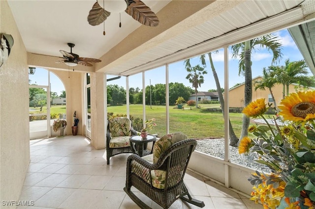 sunroom / solarium with ceiling fan