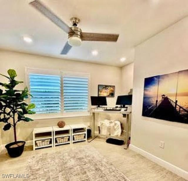 workout room with ceiling fan and carpet