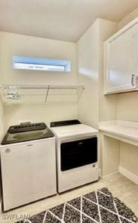 laundry area featuring washing machine and clothes dryer