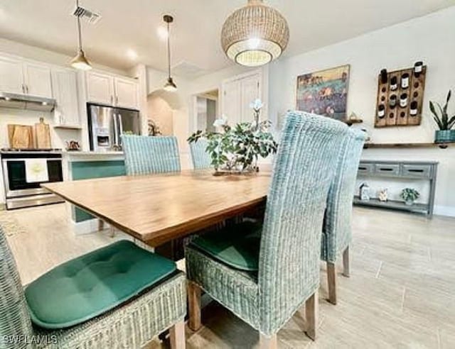 dining area featuring visible vents