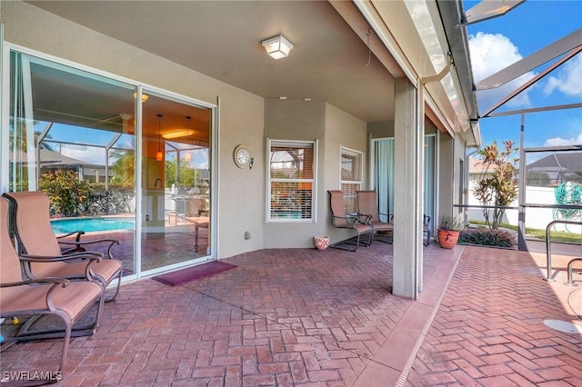 view of patio / terrace with glass enclosure