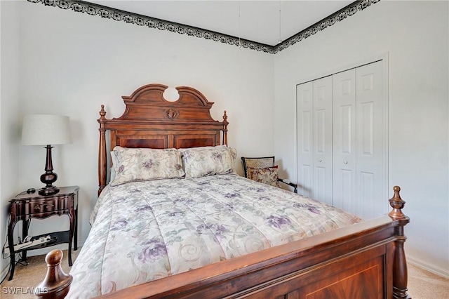 bedroom with light carpet and a closet