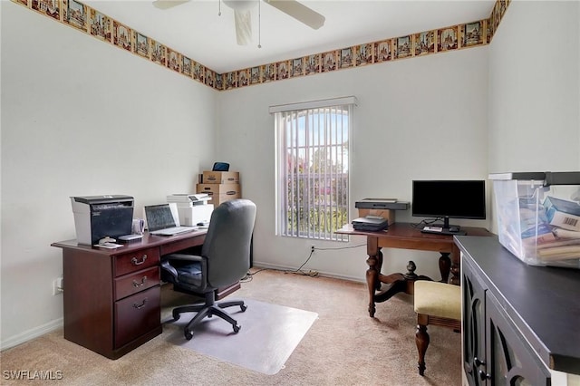 office area featuring light carpet and ceiling fan