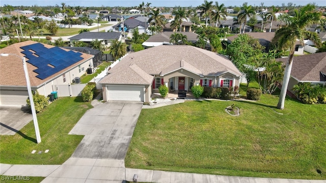 view of front facade featuring a garage and a front yard