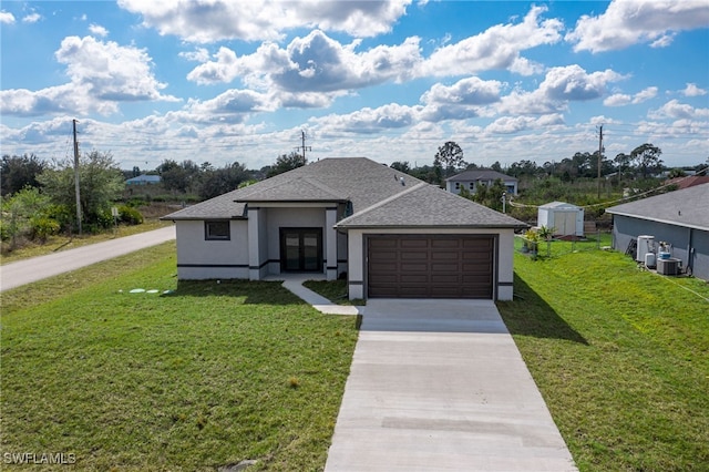 view of front of house with a garage and a front lawn