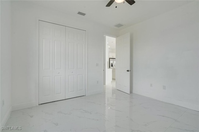 unfurnished bedroom with a closet and ceiling fan