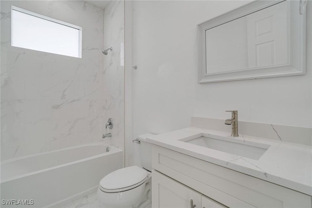 full bathroom with tiled shower / bath combo, vanity, and toilet