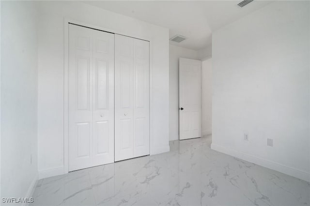 unfurnished bedroom with a closet