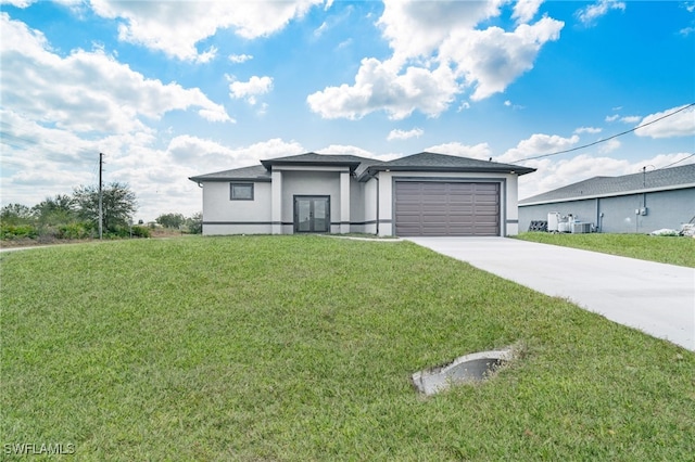 view of front of property with a garage, cooling unit, and a front lawn