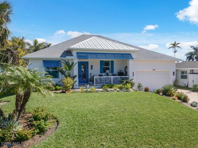 view of front facade with a porch, a garage, and a front lawn