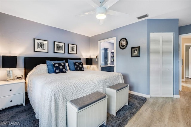 bedroom featuring ceiling fan, hardwood / wood-style floors, and a closet