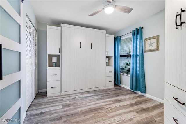 unfurnished bedroom with ceiling fan, a closet, and light hardwood / wood-style flooring