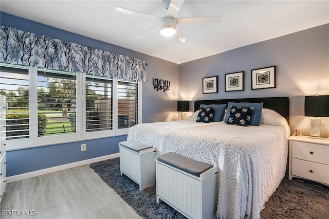 bedroom featuring hardwood / wood-style flooring and ceiling fan